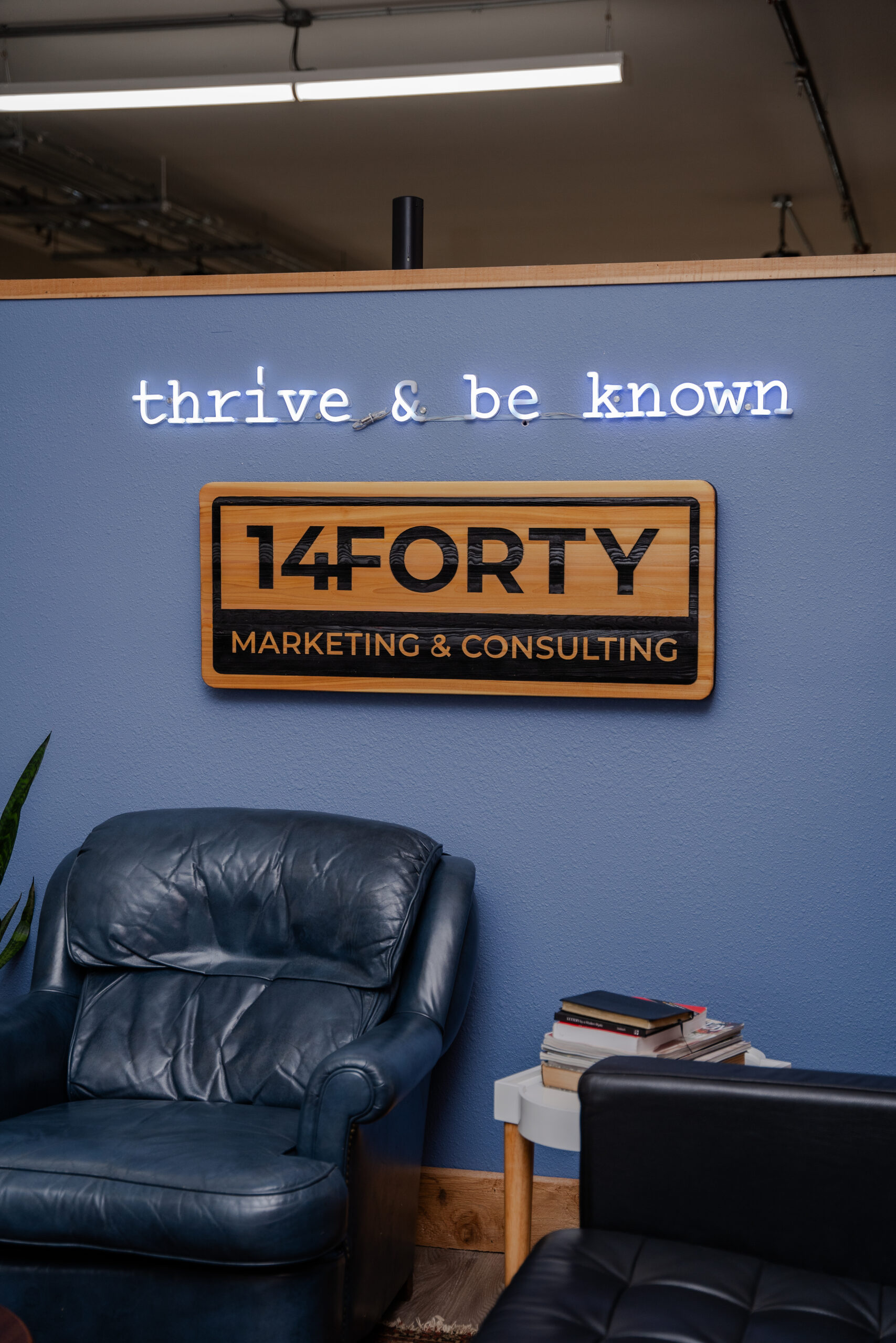 The carved 14Forty sign and neon in the studio lounge