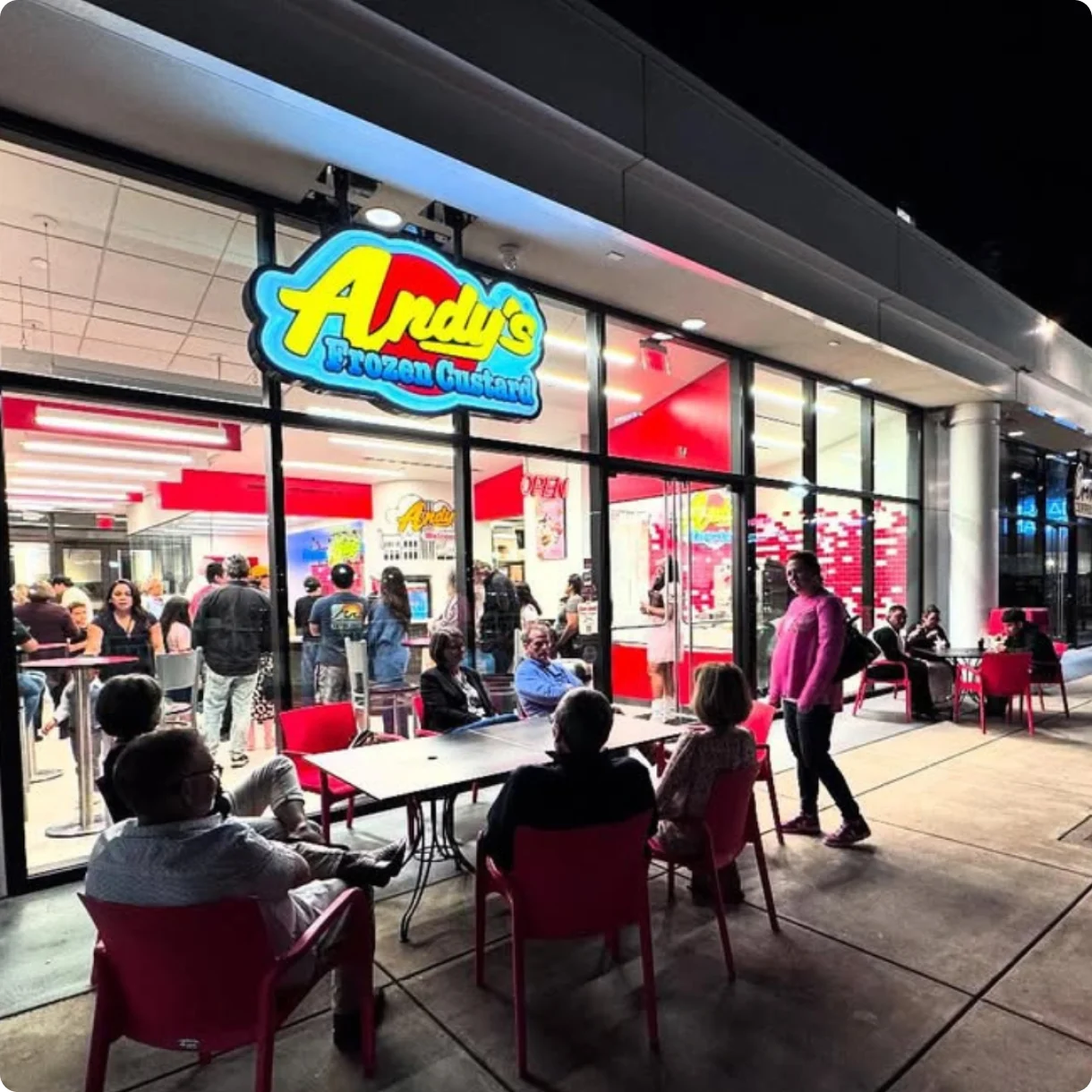 The Downtown Tyler store and patio lit up at night