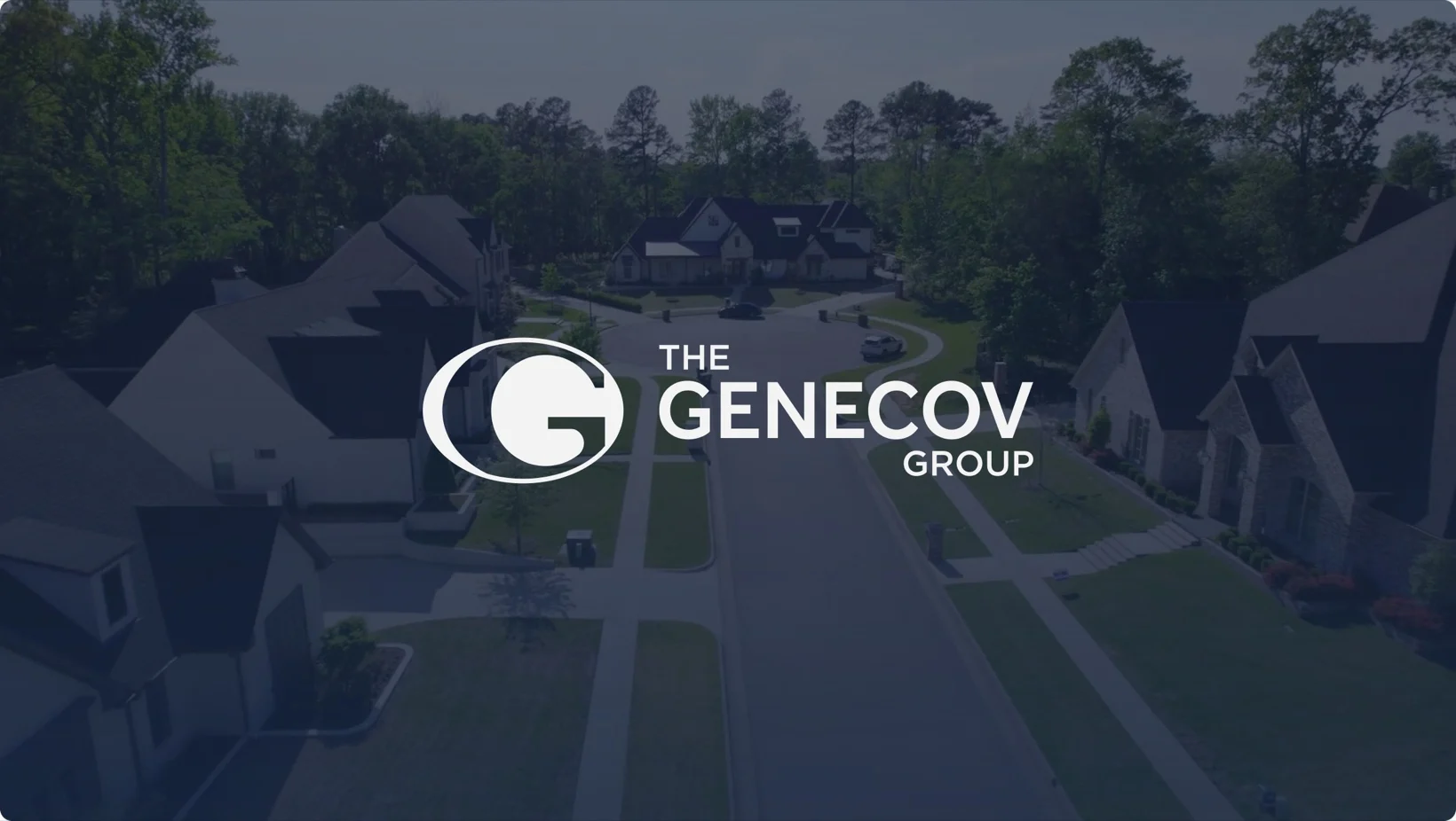 Aerial of a Genecov residential neighborhood with The Genecov Group logo